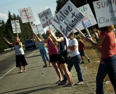 
Riverside School District teachers hold an informal picket outside of Riverside High School Friday afternoon.
 (Holly Pickett / The Spokesman-Review)