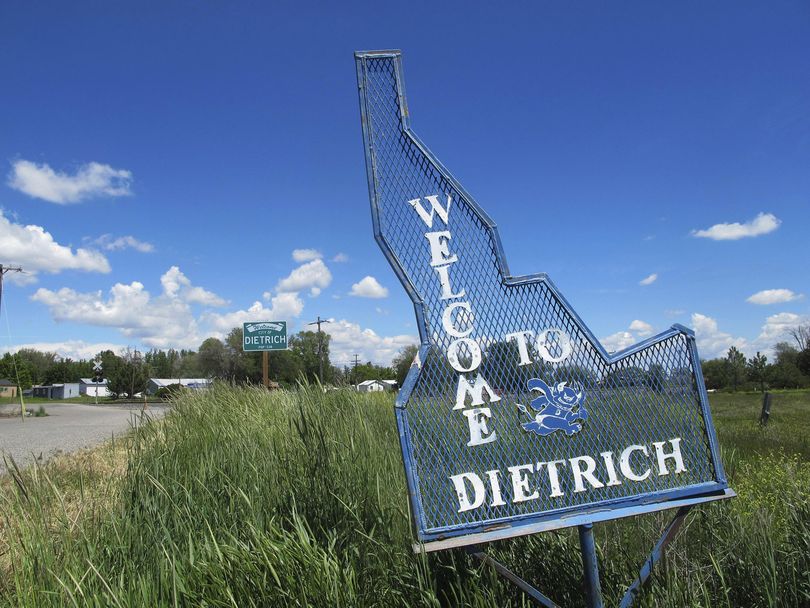 In this file photo taken Thursday, May 26, 2016, a sign welcomes residents and visitors to the tiny town in Dietrich, Idaho. Community leaders in Idaho are collecting stories of violence and discrimination in the wake of a sexual assault of a disabled black athlete by his white teammates that shocked not only a small town but residents across the state. (Kimberlee Kruesi / Associated Press)