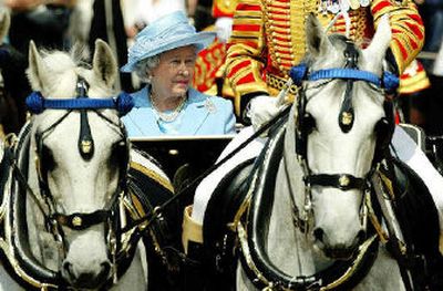 
Britain's Queen Elizabeth II arrives to inspect the troops at London's Horse Guards on Saturday before the annual Trooping the Colour parade marking her official birthday. About 1,220 troops took part in a spectacular display of precision marching and horsemanship choreographed to military band music.  
 (Associated Press / The Spokesman-Review)