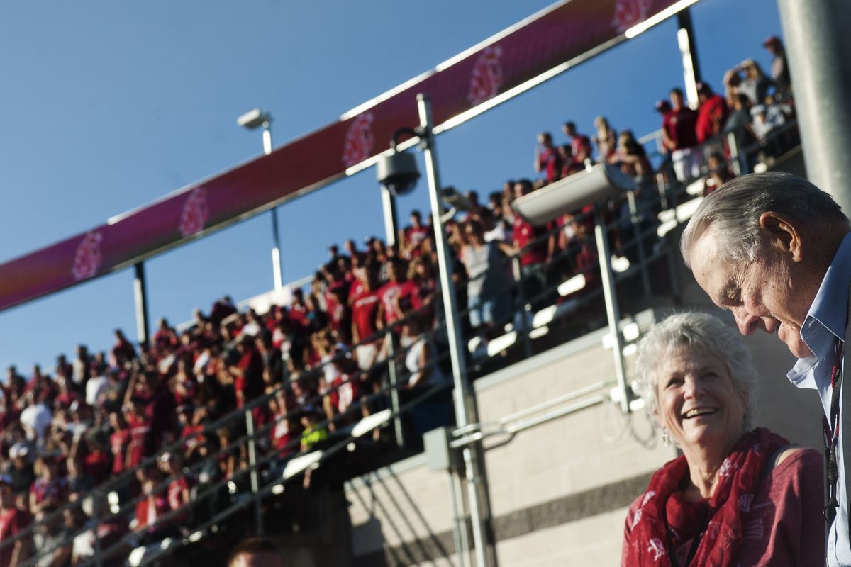 Keith Jackson enjoys an ovation from the Martin Stadium faithful Saturday after he raised the WSU flag in a pregame ceremony. (Tyler Tjomsland)