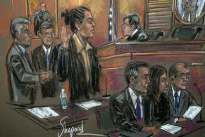 
In this courtroom sketch, Marion Jones, center, pleads guilty to lying to federal investigators. Associated Press
 (Associated Press / The Spokesman-Review)