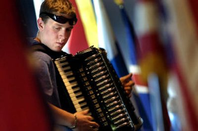 
Surrounded by flags from Scandinavian countries, Sammy Thomas, 17, concentrates as he plays the accordion at the Scandinavian Heritage Festival at the Sons of Norway on Saturday afternoon. 
 (Holly Pickett / The Spokesman-Review)