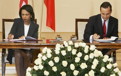Secretary of State Condoleezza Rice and Polish Foreign Minister Radek Sikorski sign an agreement to place a U.S. missile defense base in northern Poland.  (Associated Press / The Spokesman-Review)