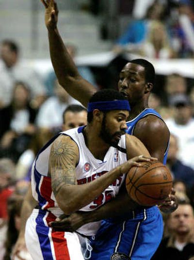 
Orlando's Dwight Howard tries to corral Detroit's Rasheed Wallace during first-quarter action on Tuesday night.Associated Press
 (Associated Press / The Spokesman-Review)