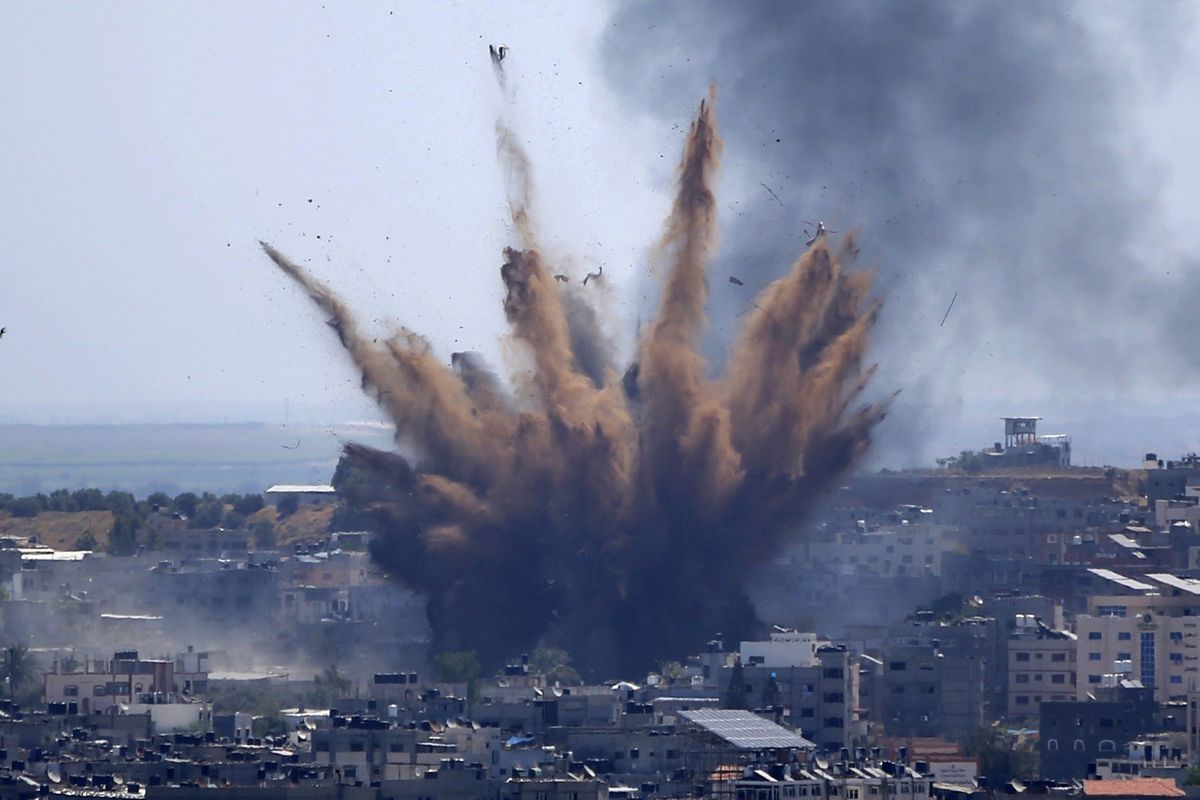 Smoke rises following Israeli airstrikes Thursday on a building in Gaza City.  (Hatem Moussa)