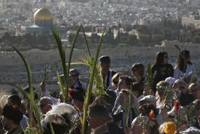 
Christian worshipers walk down the Mount of Olives, during the traditional Palm Sunday procession in Jerusalem on Sunday. Associated Press
 (Associated Press / The Spokesman-Review)