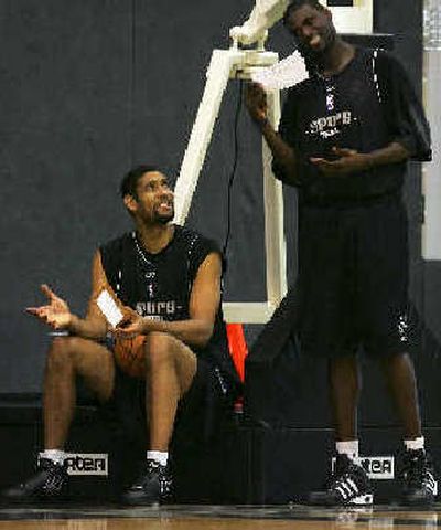 
Spurs center Tim Duncan, left, and teammate Nazr Mohammad have a little fun at practice.
 (Associated Press / The Spokesman-Review)