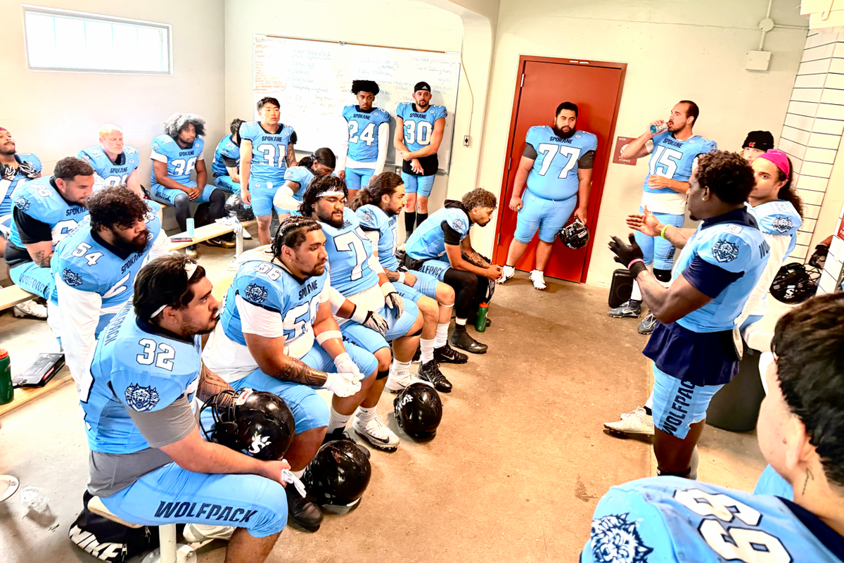 Spokane Wolfpack players and coaches gather for a team discussion at halftime, while trailing the top-seeded Grit City Knights 17-14.  (Courtesy of Connor Butner)