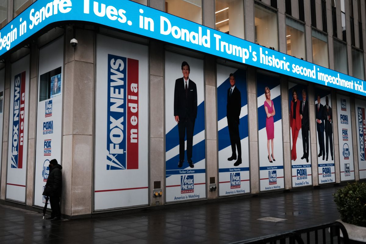 News headlines on the impeachment trial of Donald Trump are displayed outside of the Fox headquarters on February 9, 2021, in New York City.  (TRIBUNE NEWS SERVICE)