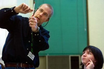 
Ray Schatz, a math teacher at Shadle Park High School, explains an algebra problem to Clayton Malmoe, 15, during a recent after-school math lab. 
 (Kathryn Stevens / The Spokesman-Review)