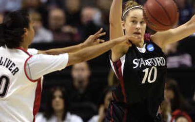 
Maryland's Kristi Toliver and Stanford's JJ Hones chase a loose ball in the first half of the Spokane Regional final in the Arena. 
 (Rajah Bose / The Spokesman-Review)
