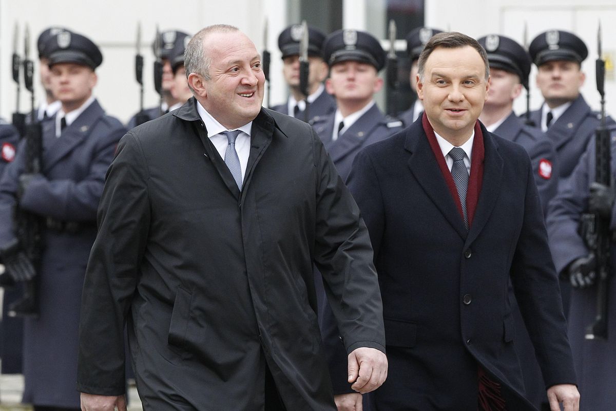 Polish President Andrzej Duda, right, and his Georgian counterpart Giorgi Margvelashvili attend a welcoming ceremony at the court of the presidential palace in Warsaw, Poland, Wednesday, Nov. 8, 2017. (Czarek Sokolowski / Associated Press)