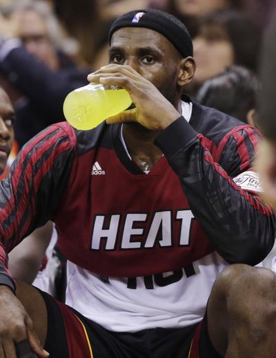 Sports drinks might be a great way for athletes like LeBron James, shown during the NBA finals in 2014, to rehydrate. Kids, however, do not generally need the calories associated with such beverages. (Eric Gay / AP)