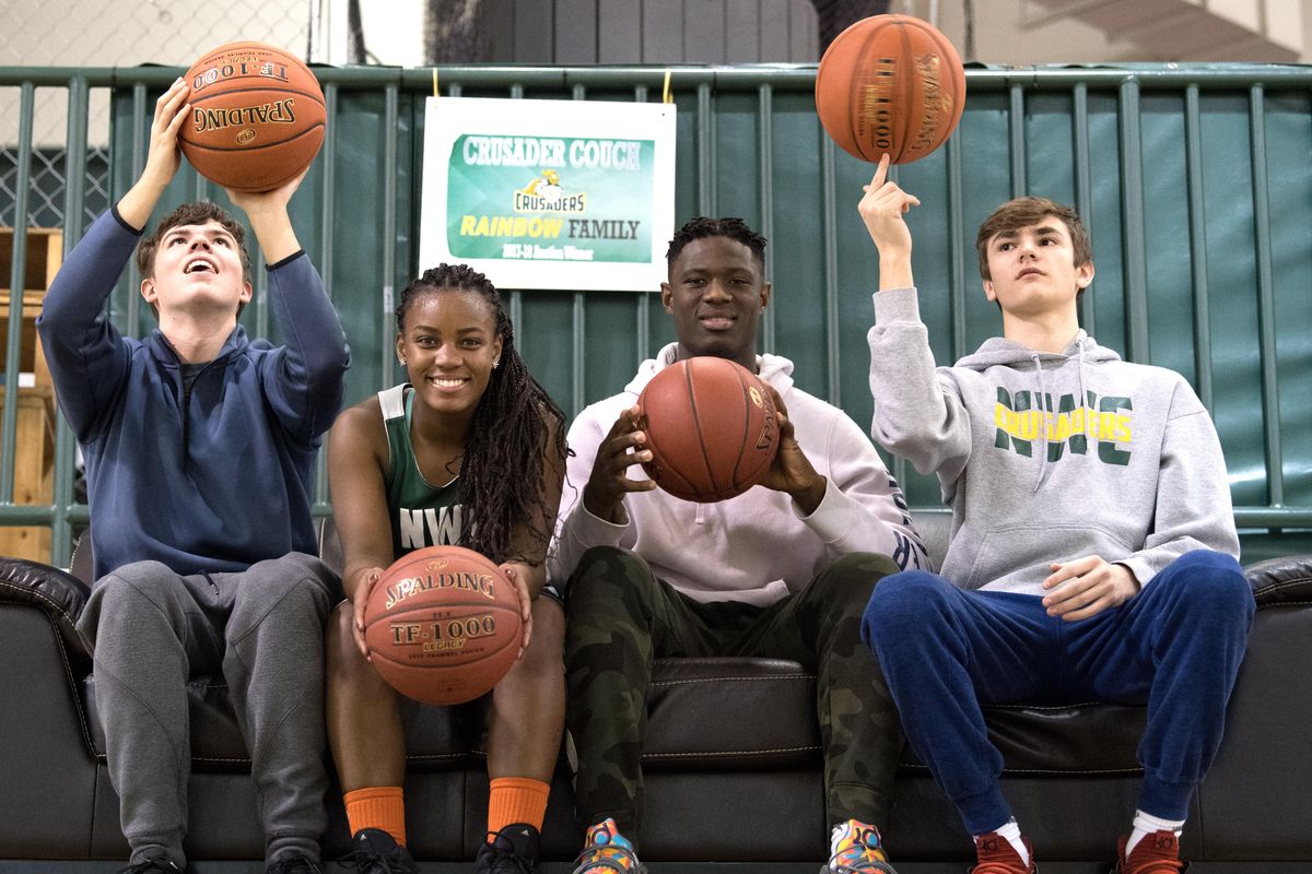 Simpson siblings, from left, Dane, Christelle, Eckahelo and Kobe, pose for a photo last Thursday  in the Northwest Christian gym in Colbert, Wash. (Tyler Tjomsland / The Spokesman-Review)
