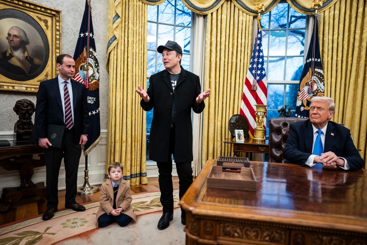 Elon Musk speaks to reporters on Feb. 11 after President Trump signed an executive order empowering Musk