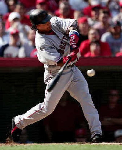 
Manny Ramirez rips a three-run home run in the fourth inning of Boston's 9-3 victory on Tuesday. 
 (Associated Press / The Spokesman-Review)