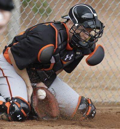 San Francisco’s Buster Posey participates in first catching drill following injury-shortened 2011 season. (Associated Press)