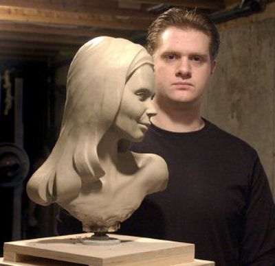 
Casey Sargent poses with his untitled sculpture at his Spokane Valley studio. When asked who the subject was, he responded, 