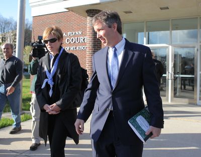 FILE - In a Thursday,  April 12, 2012 file photo, Douglas Kennedy, right, son of the late Sen. Robert F. Kennedy, arrives early to a locked door at village court in Mount Kisco, N.Y. Kennedy is in court Monday, Oct. 22, 2012 in Mount Kisco, N.Y on charges of physical harassment and child endangerment for trying to take his newborn son out of a hospital without permission on Jan. 7. A New York prosecutor says Kennedy kicked a nurse to the floor as he tried take his newborn son out of a hospital.  But a defense lawyer says Douglas Kennedy acted instinctively to protect the baby. (Xavier Mascare� / The Journal News)