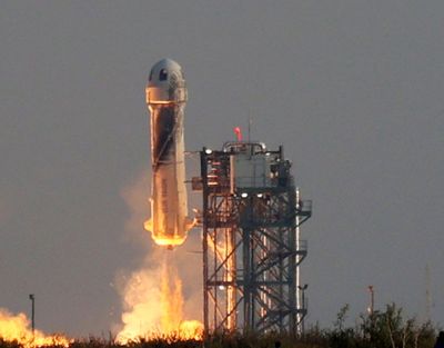 Blue Origin’s New Shepard rocket lifts off on July 20, 2021, in Van Horn, Texas.  (Joe Raedle)