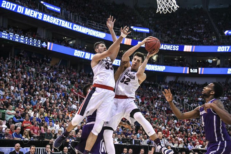 Gonzaga forwards Killian Tillie (33) and Zach Collins (32) beat Northwestern forward Vic law to a rebound during their NCAA second round game, March 18, 2017, in Salt Lake City. (Dan Pelle / The Spokesman-Review)