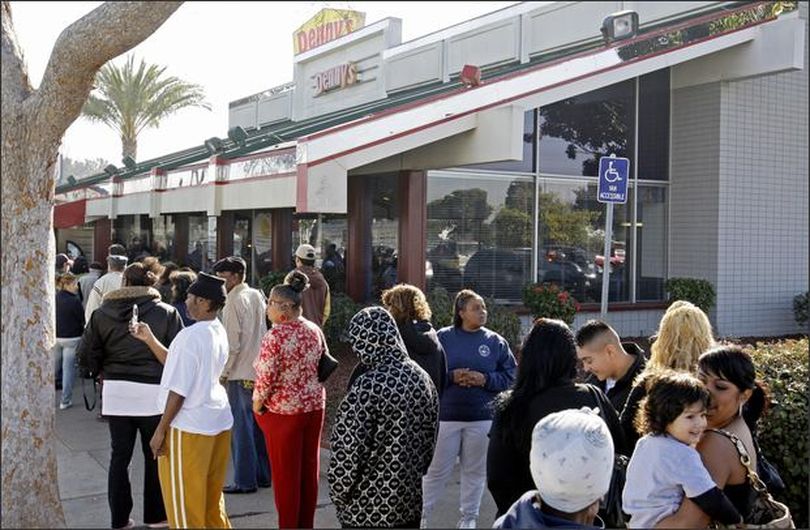 People form a line outside the entrance of Denny's restaurant Tuesday in San Leandro, Calif., as they wait for a free breakfast. (AP Photo/Ben Margot) (February 03, 2009) (The Spokesman-Review)