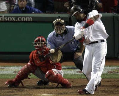 Boston's Manny Ramirez connects for the game-winning three-run homer in the bottom of the ninth. Associated Press
(Associated Press / The Spokesman-Review)