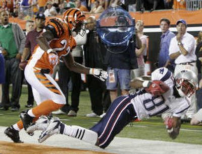 Associated Press Johnathan Joseph of Cincinnati can't prevent Randy Moss from making this touchdown reception for New England.
 (Associated Press / The Spokesman-Review)