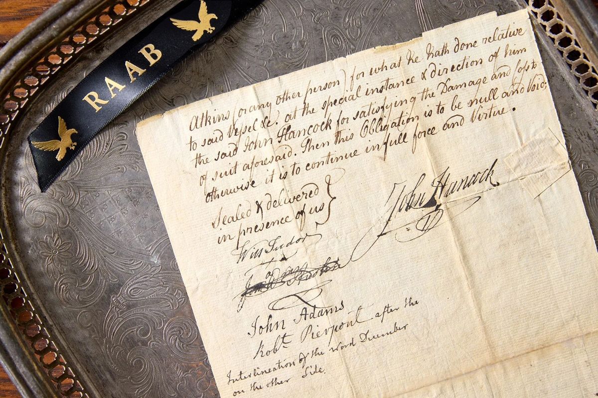 A 1771 document is signed by both John Hancock and John Adams. Adams, a lawyer, represented Hancock in a legal dispute.  (Raab Collection)