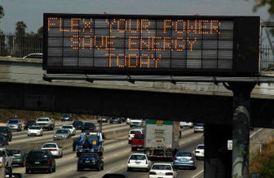 
A freeway traffic information sign urges commuters to save energy in Los Angeles on Monday as a Stage 2 power shortage alert has been issued for California.
 (Associated Press / The Spokesman-Review)