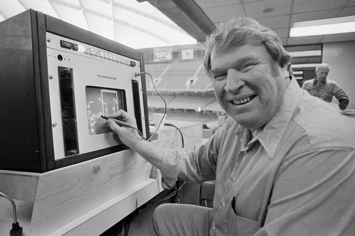 FILE - Former Oakland Raiders coach John Madden practices the electronic charting device Telestrator on Jan. 21, 1982, in Pontiac, Mich., for the upcoming NFL football Super Bowl broadcast on CBS. Madden, the Hall of Fame coach turned broadcaster whose exuberant calls combined with simple explanations provided a weekly soundtrack to NFL games for three decades, died Tuesday morning, Dec. 28, 2021, the league said. He was 85. The NFL said he died unexpectedly and did not detail a cause.  (STF)