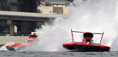 
Miss Budweiser driver Dave Villwock , right, uses the inside lane to race past Terry Troxell in Miss Elam Plus on Saturday. 
 (Associated Press / The Spokesman-Review)