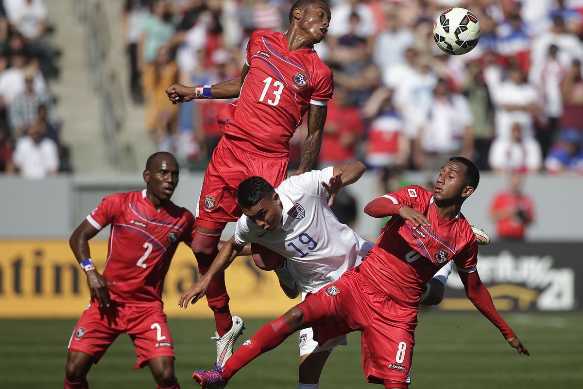 United State’s Miguel Ibarra finds himself in a swarm of Panamian players, including Alfredo Stephens, top, who heads the ball. (Associated Press)