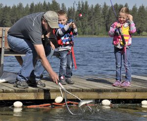 Taking kids fishing and helping them catch their first fish is a privilege not to be missed. (Rich Landers)
