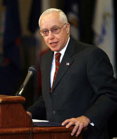 
Attorney General Michael Mukasey is encouraging gun dealers to check the FBI's 