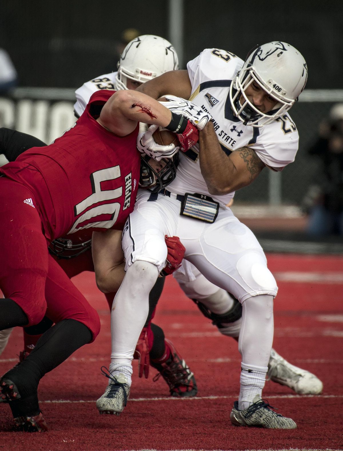 Eastern Washington linebacker Ketner Kupp  tries to strip the ball from Montana State running back Nick LaSane  during the first half  Oct. 14, 2017, in Cheney. (Colin Mulvany / The Spokesman-Review)
