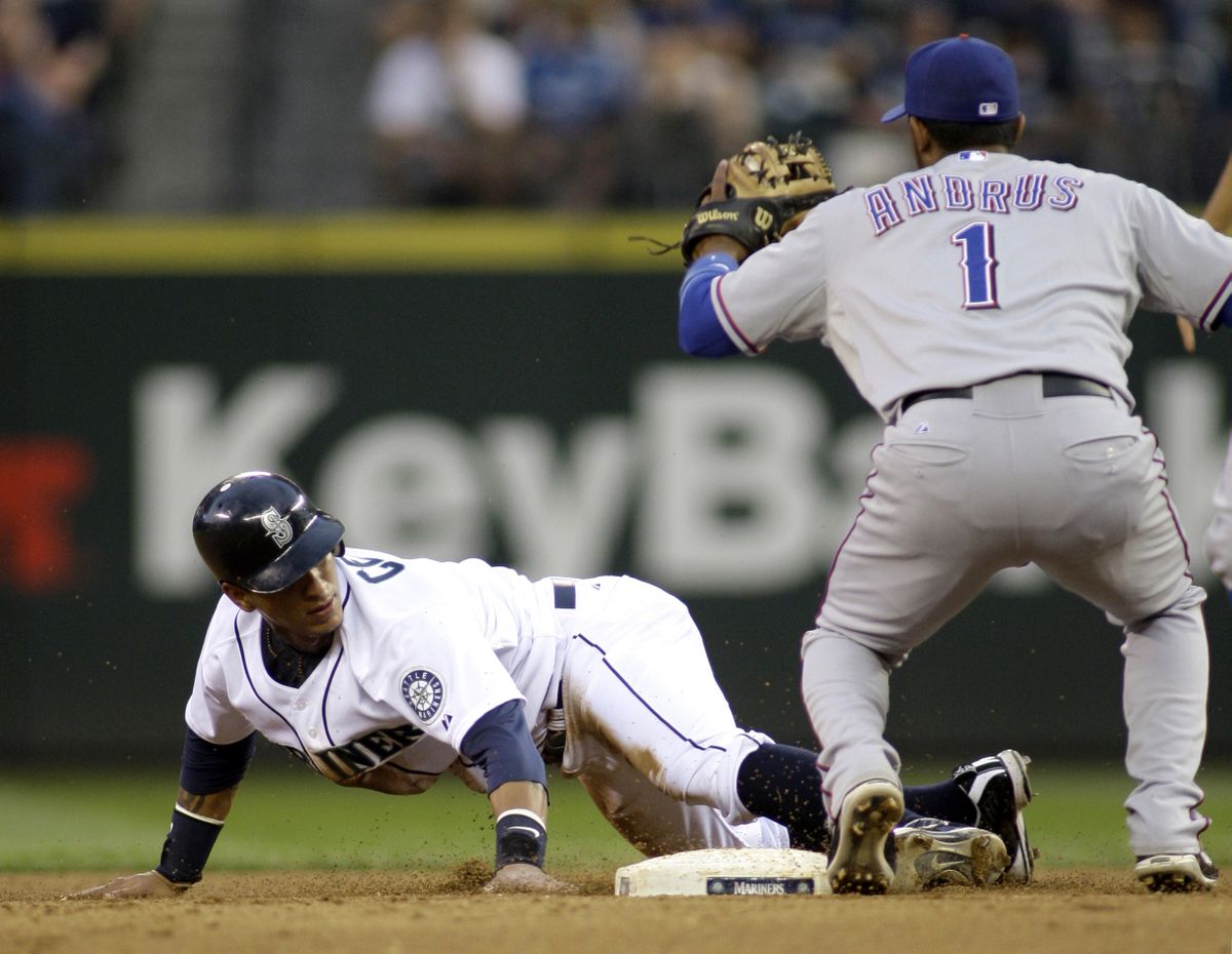 Mariners’ Ronny Cedeno steals second base in the fifth inning.  (Associated Press / The Spokesman-Review)