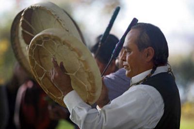 
Randy Minthorn, of the Umatilla tribe, drums Friday during  a blessing ceremony to prepare Sacajawea State Park, near Pasco. The park will be one of seven sites of the Confluence Project. 
 (Associated Press / The Spokesman-Review)