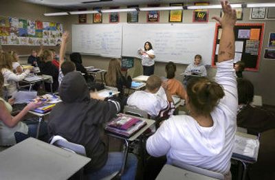 
Ausha Budell, front right,  of North Central High School, responds to a question in Joanne Cande-laria's  AVID class Thursday. 
 (Christopher Anderson / The Spokesman-Review)