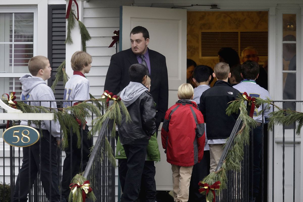 Mourners arrive for the funeral service of Sandy Hook Elementary School shooting victim, Jack Pinto, 6,  Monday, Dec. 17, 2012, in Newtown, Conn. A gunman walked into Sandy Hook Elementary School in Newtown Friday and opened fire, killing 26 people, including 20 children. (David Goldman / Associated Press)