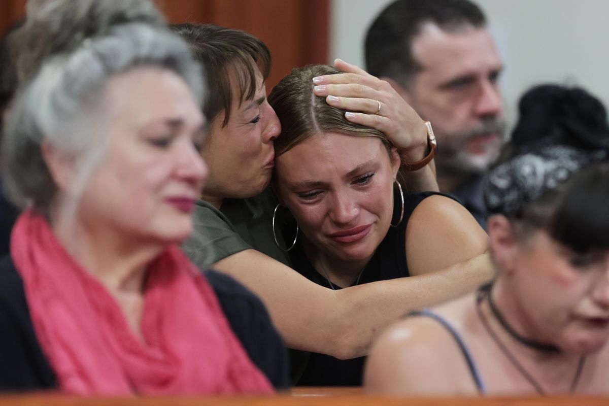 Dylan Mortensen gets a hug Wednesday after speaking at the sentencing hearing of Bryan Kohberger at the Ada County Courthouse in Boise. (Kyle Green, Pool)