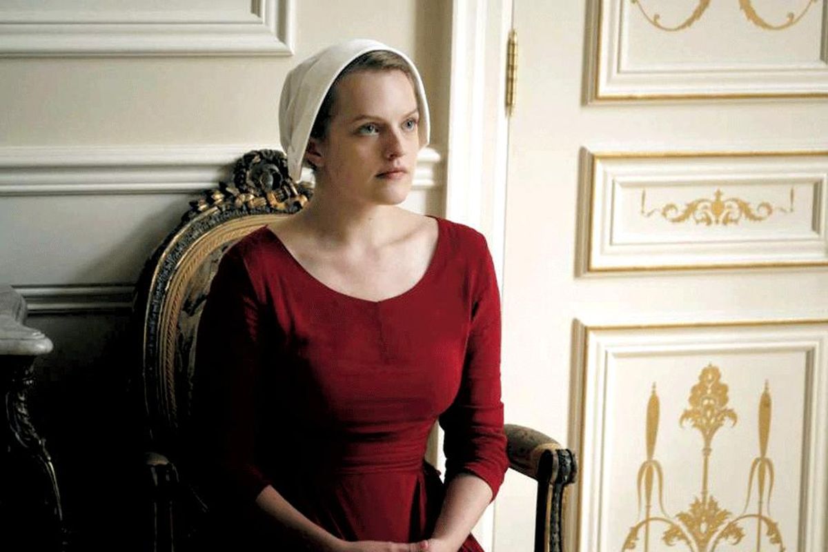 Offred (Elisabeth Moss) lives in the biblically based dystopia of “The Handmaid’s Tale.” (Take Five-Hulu / Take Five-Hulu)