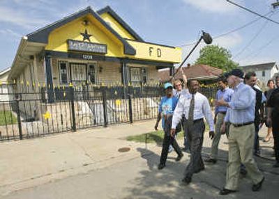 
Republican presidential candidate Sen. John McCain, R-Ariz., right, walks past Fats Domino's house during a tour of New Orleans' Lower Ninth Ward on Thursday. Associated Press
 (Associated Press / The Spokesman-Review)