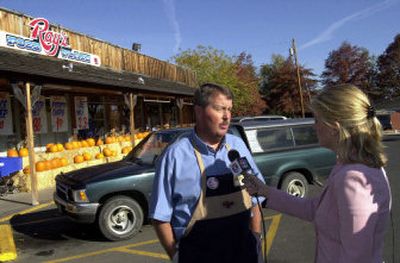 
Randy Lewis, manager of the Ray's Food Place store in Jacksonville, Ore., speaks with a television reporter Thursday. A Powerball ticket worth $340 million was sold at one of two retailers in Jacksonville, Ray's Food Place or J'ville Tavern. 
 (Associated Press / The Spokesman-Review)