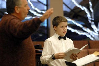 
Jackson Hern, 12, right, practices with the Northwest Sacred Music Chorale and director John Lemke, left,  at the Community Presbyterian Church in Post Falls. 
 (Jesse Tinsley / The Spokesman-Review)