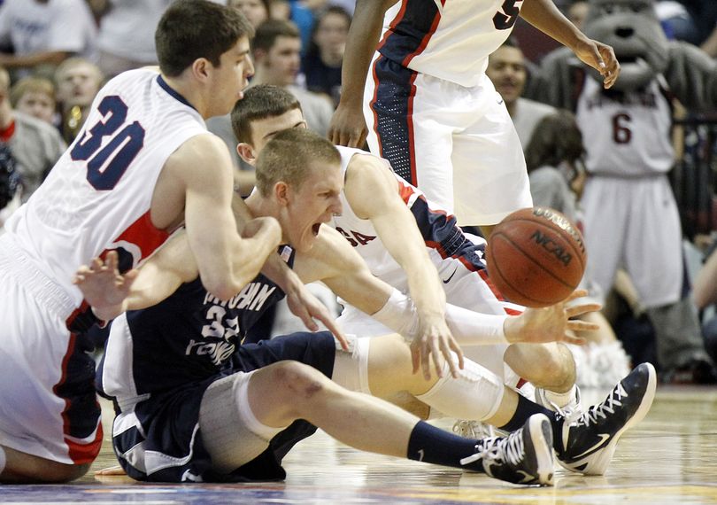 BYU's Nate Austin reaches for a loose ball with Gonzaga's Mike Hart, left, during the first half of an NCAA college basketball game at the West Coast Conference tournament on Saturday, March 3, 2012, in Las Vegas. (Isaac Brekken / Fr159466 Ap)