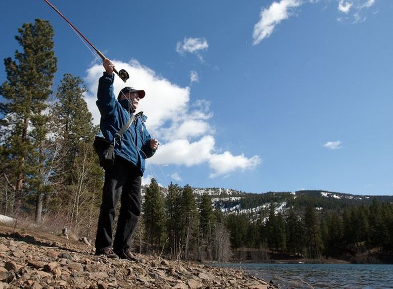 Tony Eldred practices fly casting on Lily Lake April 21 using line without a hook or lure. He was honored in Olympia on March 31 for serving the longest time of any state employee — 53 continuous years. He recently retired from his position as liaison between the state Department of Fish and Wildlife and public utilities. Health reasons forced his retirement early this year.

 (Associated Press)