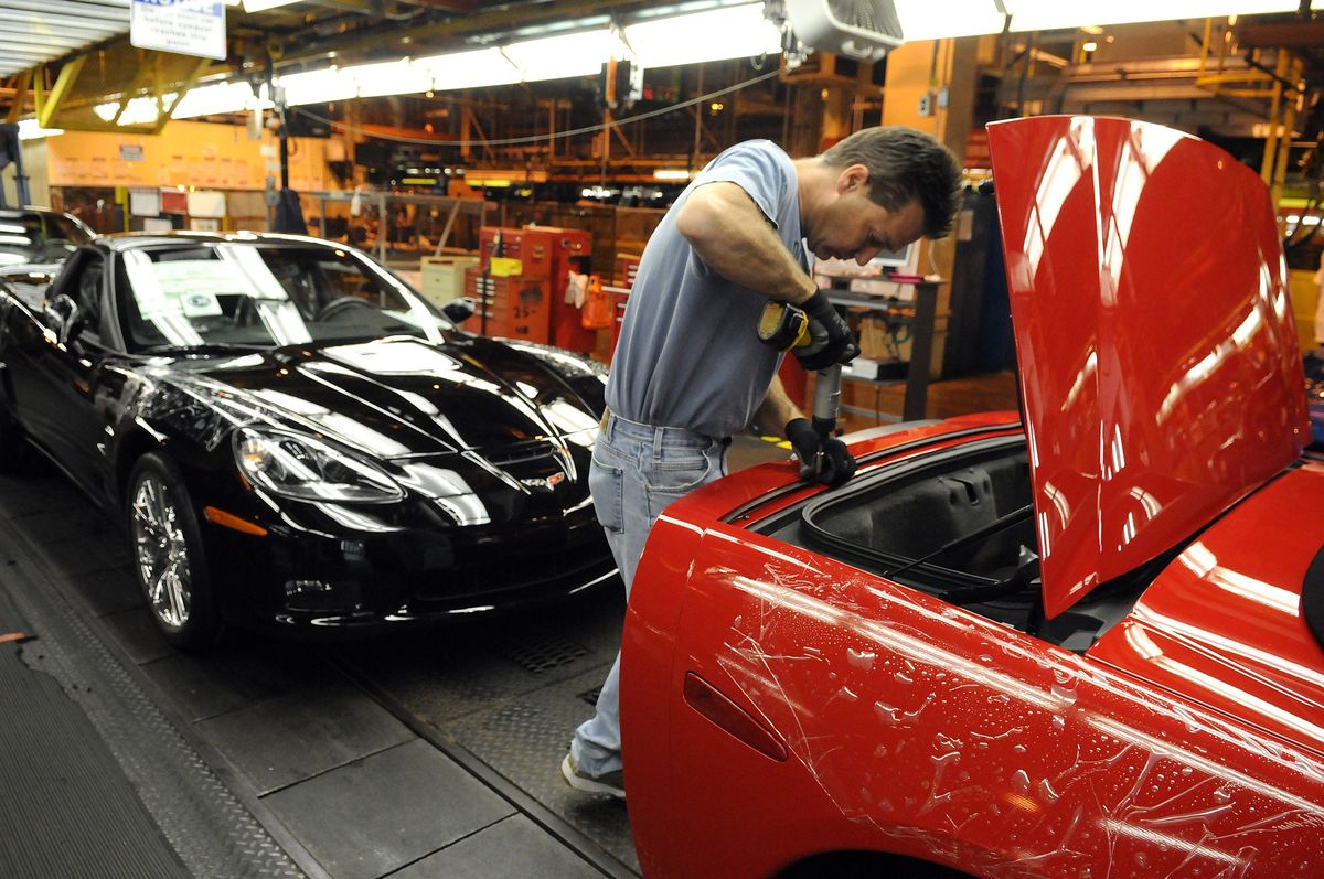 General Motors Corvette assembly plant worker Scott Campbell puts the finishing touches on a Corvette at the Bowling Green, Ky., plant. General Motors Corp. and Chrysler LLC presented plans to Congress Tuesday to restructure their businesses. (File photos Associated Press / The Spokesman-Review)