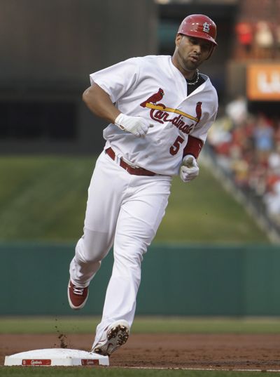 Albert Pujols had 3 hits and scored 3 runs in Cards’ win. (Associated Press)