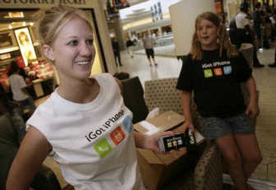 
Teenagers wait in line to purchase an iPhone last week in Denver.Associated Press
 (Associated Press / The Spokesman-Review)